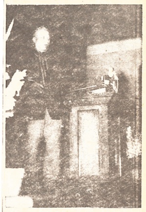 SPEAKS AT ANNIVERSARY — Rev. William O. [sic J.] Brenneman is shown above giving his testimony at the 64th anniversary and homecoming observance of the Union Avenue Mennonite Church in Chicago, formerly the Mennonite Home Mission.